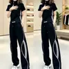 Conjunto de moda callejera para mujer, estilo coreano moderno, conjunto de dos piezas casual deportivo de alta gama con pantalones anchos de manga corta