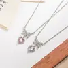 Nuevo collar con forma de lazo de corazón de circón de diamante rosa para mujer, diseño de nicho de lujo ligero con un toque de alta gama, cadena para la clavícula de circón de diamante morado