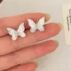 Elegante temperamento dulce temperamento alto sentido cristal rosa mariposa amor pendientes moda lujo perla borla pendientes