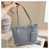 Bolsa de Ombro Grande e Elegante para o Trabalho Feminino Outono 2026 Nova Bolsa Simples de Ombro Alta Aparência Estilo Coreano Bolsa Tote