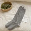 Calcetines de ternera blancos lechosos con borde de volantes para mujer, calcetines largos apilables de primavera y otoño con encaje hueco, calcetines altos JK sin costuras