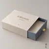 Empaque de caja de papel, caja colorida con forma de libro y cierre magnético, acabado liso, lista para la venta al por menor, exquisita y elegante, duradera, lujosa y que emana un aura cálida y refinada