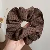 Elástico de Cabelo com Estampa de Leopardo Estilo Retrô para Mulheres 2025 Novo Estilo Suave Elegante Nicho Alto Padrão Elástico de Cabelo