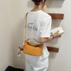Elegante bolso pequeño de patrón tejido para mujer, nueva moda otoño 2026, bandolera versátil estilo Ins, bolso tipo empanada, bolso lingote