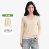 Top de mujer de algodón de bambú, cuello en V moderno, corte en el hombro derecho, manga larga, ligeramente transparente, fino, elegante, ajustado, versátil y perfecto como capa base
