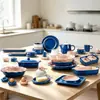 Juego de vajilla de cerámica de color bloque azul nórdico y rosa para uso doméstico, que incluye cuencos, platos, tazas, teteras, platos decorativos y moldes para hornear únicos, disponibles para exportación al por mayor.