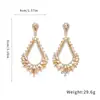 Pendientes Huecos de Gota de Agua con Incrustaciones de Diamante y Aguja Plateada para Mujer, Pendientes de Lujo Ligero de Gama Alta, Pendientes Exagerados Europeos y Americanos con Sentido del Diseño, Nicho