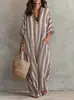 Moda Transfronteriza Europea y Americana para Mujer 2026 Vestido Holgado de Rayas de Venta Caliente con Estampado Plisado, Falda Larga Falsa con Bolsillos, Vestido de Playa