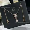 Collar de Perfume V Gold Versión Alta No. 5 para Mujer Doble C Completo con Diamantes Borla Colgante de Gota de Agua Cadena Clavícula Coco Tendencia Pequeña Fragancia