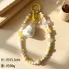 Colgante de pato de moda con lazo, cuentas de queso, llavero, correa para teléfono, accesorio para bolso, accesorio de bricolaje, regalo