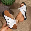 Nuevas sandalias de verano 2024 de comercio exterior boca de pez, chanclas cruzadas, talla grande, lazo, tacón de plataforma inclinada, línea de balanceo, huecas