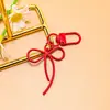 Llavero de lazo de cuentas estilo INS de colores con cinta, colgante de aleación, accesorio para niñas, charm para mochila, accesorio de hebilla para puerta