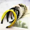Directo de fábrica nueva versátil terciopelo uña nudo de perla diadema color coreano medio nudo de perla anillo para el pelo