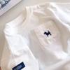 Camiseta de manga corta para niño, nueva camiseta de verano de algodón para niños, blanca, de media manga, holgada e informal, a la moda.