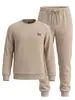 Conjunto esportivo masculino, jacquard liso com etiqueta de couro, moletom de gola redonda, calça casual solta com cordão e punhos, estilo casual americano