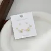 Aguja de plata S925 corazón de melocotón lazo una tarjeta tres pares de pendientes de botón para mujer diseño simple nuevo conjunto de tres piezas pendientes moda venta al por mayor