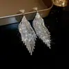 Aretes de Aguja Plateada con Borlas de Gota de Agua Incrustadas de Diamantes, Estilo Palacio, Nicho, Aretes Versátiles, Lujo Ligero, Venta al por Mayor de Aretes de Gama Alta