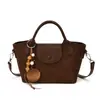 Bolsa de Mão Outono 2026 Feminina Nova Tendência Outono Pequena Nicho Casual Bolsa de Ombro para o Trabalho Transversal Sensação de Alto Padrão Bolsa Saco