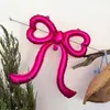 Nuevas decoraciones de globos con forma de lazo de corazón para crear un ambiente sofisticado de estilo coreano en cafeterías y pastelerías, perfectas para celebraciones de cumpleaños