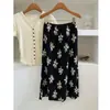 Falda plisada estampada para mujer, estilo vacaciones de verano 2026, elegancia francesa, estampado floral negro, de longitud media, corte recto