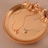 Moda simple pequeño fresco hueco colgante de amor collar para mujer versátil ins cadena de clavícula en forma de corazón alta calidad al por mayor