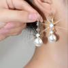 Pendientes de gancho para la oreja con colgante de perla para mujer, elegantes y sencillos, a la moda, para mujer, 2023, nuevos y populares pendientes adelgazantes para el rostro.