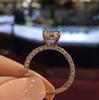 Deseo Nuevo anillo de princesa redondo con diamantes brillantes y creativos de gran venta, anillo de diamantes de propuesta de compromiso para mujeres de moda europea y americana.