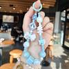 Llavero con pulsera de cuentas de Sanrio de dibujos animados, bonito colgante de bolso Kulomi, llavero acrílico, pequeño regalo