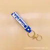 Chaveiro pingente de pirulito atacado de fábrica chaveiro de letra de doce fofo pingente de corda de couro presente criativo
