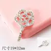 Nuevos accesorios de colgante de aleación DIY Colgante Dios del Sol Broche de gema Flor de aleación Perla Diamante Joyería al por mayor