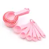 Fábrica de origen en stock plástico color taza medidora cuchara medidora traje cuchara medidora negra traje taza medidora de báscula para hornear