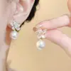 Estilo Caliente 2025 Pinzas para Oreja sin Perforar para Mujer, Flores de Camelia, Estilo Francés, Suave Elegante, Dulce Joyería para Oreja Fabricante Mayorista