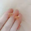 Nuevos pendientes de lazo 2021 pendientes huecos de encaje de amor temperamento dulce diseño de nicho pendientes de corazón de chica