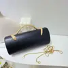 Nuevo bolso de noche de lujo ligero transfronterizo para mujer, bolso de mano cilíndrico de color liso con asa de serpiente para fiestas de cóctel y banquetes