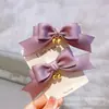 Versión coreana de tocado para niños accesorios para el cabello niños un par de cascabeles en bolsa lazo de tela pinza lateral se puede usar como pinza superior pasador