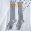 Calcetines de té para la cara al por mayor color sólido dos barras rayas verticales hasta la rodilla calcetines de mujer moda urbana media pantorrilla calcetines de mujer