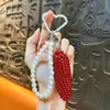 Pingente de chaveiro de corrente de pérolas de frutas simuladas, doce e versátil, design fresco e simples, moderno e único