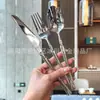 Lujo Ligero Pequeño Hombre Cintura Acero Inoxidable 304 Cuchillo, Tenedor y Cuchara Traje Vajilla Hogar Occidental Fideos Brillantes Cuchillo para Bistec Restaurante Venta al por Mayor