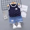Versão coreana de verão novo conjunto de duas peças para meninos: colete com estampa total de âncora e anzol, shorts jeans. Atacado