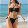 Traje de baño de dos piezas para mujer para comercio exterior transfronterizo, color liso con cuello halter y tirantes cruzados, cadena de conchas, diseño hueco y bikini de atar