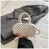 Bolso de lunares de nicho transfronterizo para mujer, nuevo y exquisito minibolso cruzado versátil 2026, bolso cilíndrico de un solo hombro a la moda