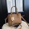 Bolso de cubo de mano de lujo ligero de alta gama 2026 nuevo estilo moderno para el trabajo versátil de un solo hombro bandolera bolso pequeño de mano para salir