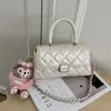 Bolso de hombro cruzado para mujer con cadena de rombos transfronteriza, diseño de nicho nuevo para el verano de 2026, bolso de mano pequeño cuadrado con sensación de alta gama