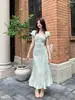 Xiu Xixi Marca Blanca - Vestido Corto de Verano con Estampado de Flores de Cerezo Tardío, Giro Romántico Francés, Nudo, Corte Diagonal Suave, Volantes, Manga Corta 88599