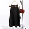 Feiyuan ofrece una falda de línea A simple y elegante con una cintura ancha, en un color liso.. Esta nueva colección de otoño/invierno presenta una falda larga de mezcla de lana de cintura alta, estilizada y versátil.
