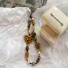 Cadena para teléfono móvil de caramelo duro ámbar casero original Ins cámara ccd cuentas diy cordón frío colgante retro