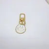 Comercio Electrónico Transfronterizo Aleación Colorido Cara Sonriente Esmaltada Llavero Chapado en Oro Expresión Asimétrica Accesorios Colgantes para Bolsos