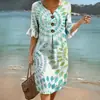 Vestido de comercio exterior transfronterizo 2026, nuevo estampado floral, suelto y adelgazante, vestido de vacaciones en la playa para mujer