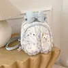 Mochila linda con estampado de dibujos animados estilo coreano transfronteriza para mujer, diseño de nicho con lazo dulce, bolso de mano versátil