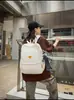 Mochila retro de gran capacidad para mujer, nuevo modelo 2026, diseño de bloques de color de nicho, tacto de alta gama, adecuada para viajes y como mochila escolar